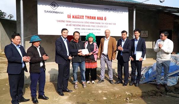 A group of people standing in front of a sign

AI-generated content may be incorrect.